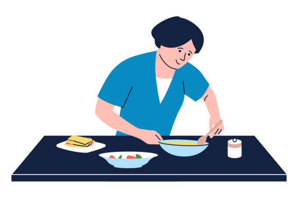 A Woman is Cooking Food on a Table